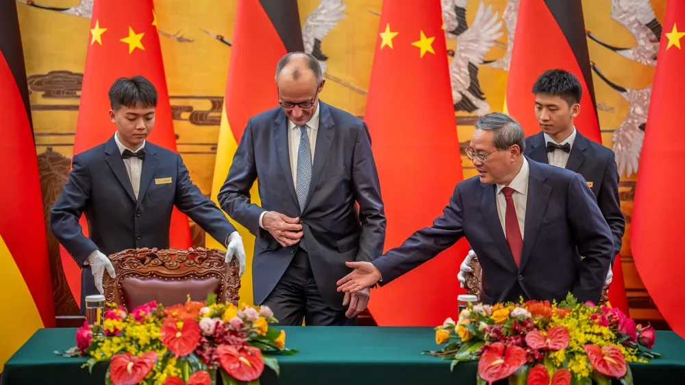 Merz und Li wollen freien Handel fördern