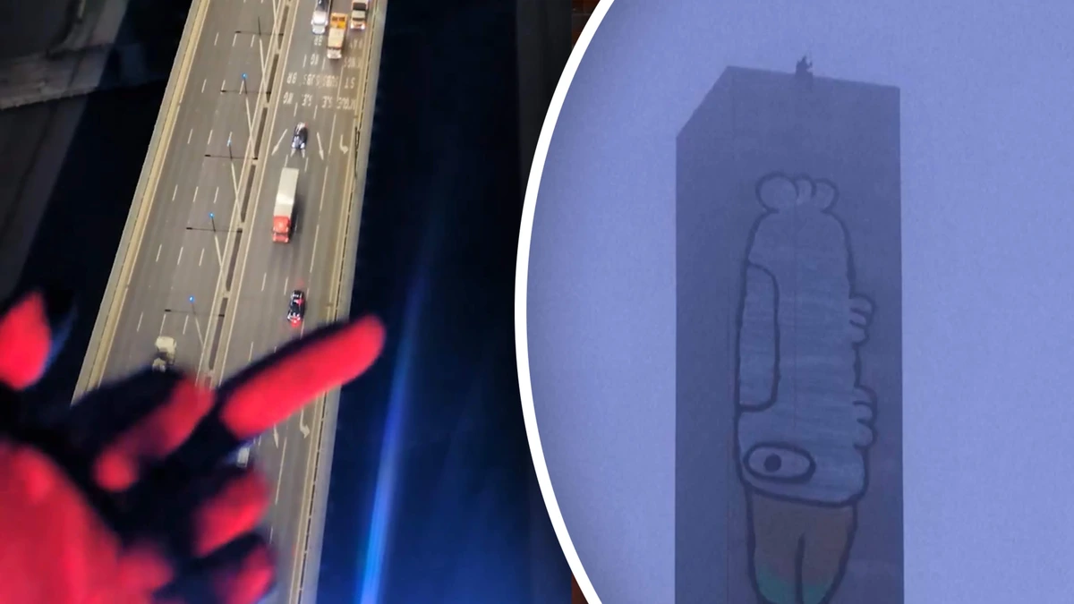 Man schildert gigantische cartoon op toren en weigert er van af te komen