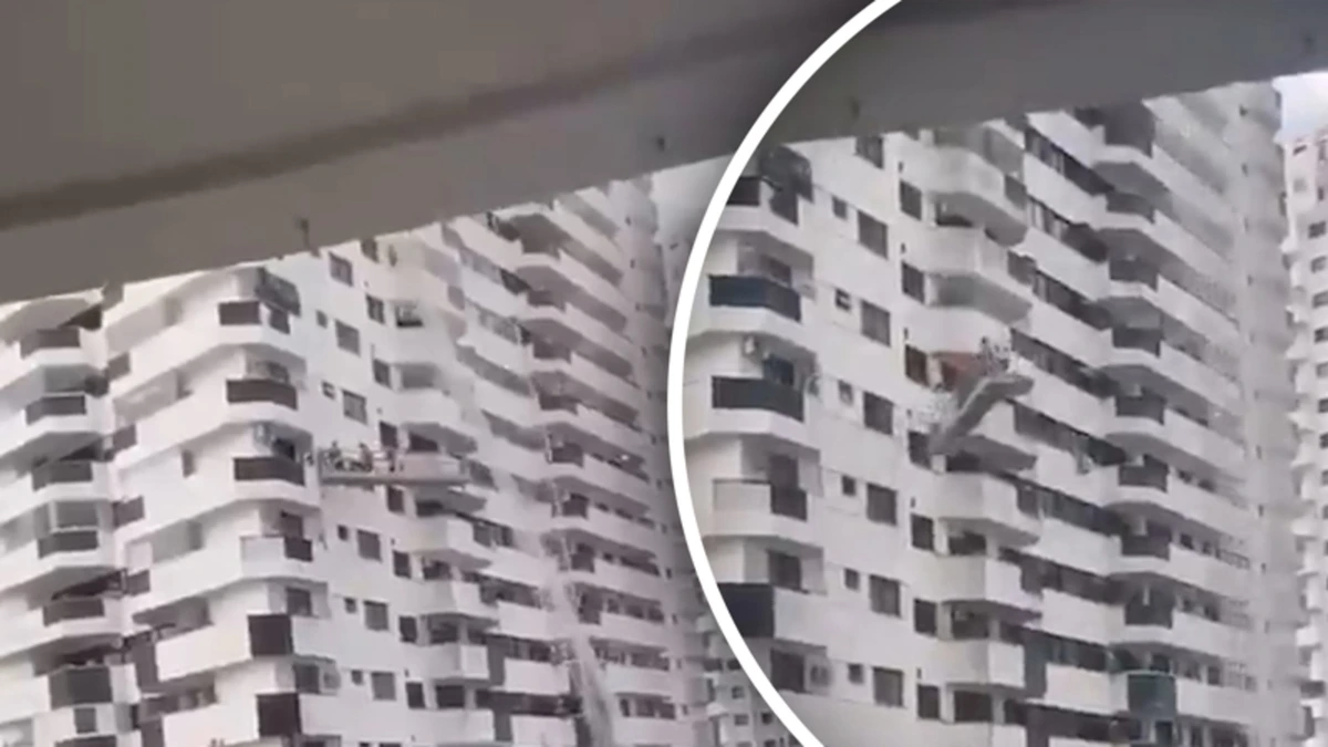 Schilders bungelen heen en weer in gondel tijdens storm in Brazilië