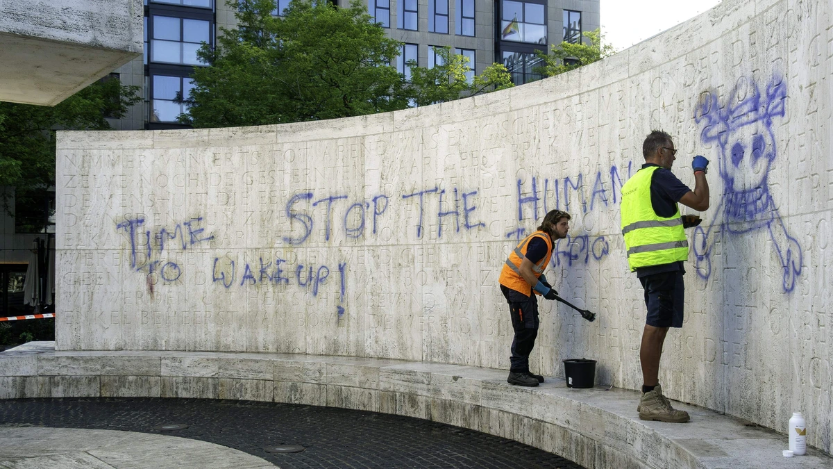 Een verdachte bekladding Nationaal Monument blijft vastzitten, tweede man later op de dag op vrije voeten