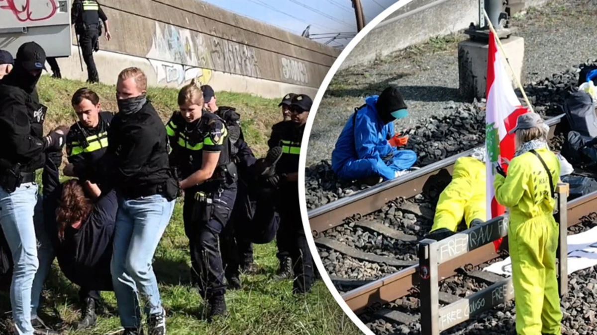 Actievoerders bezetten spoor bij Herveld, politie grijpt in