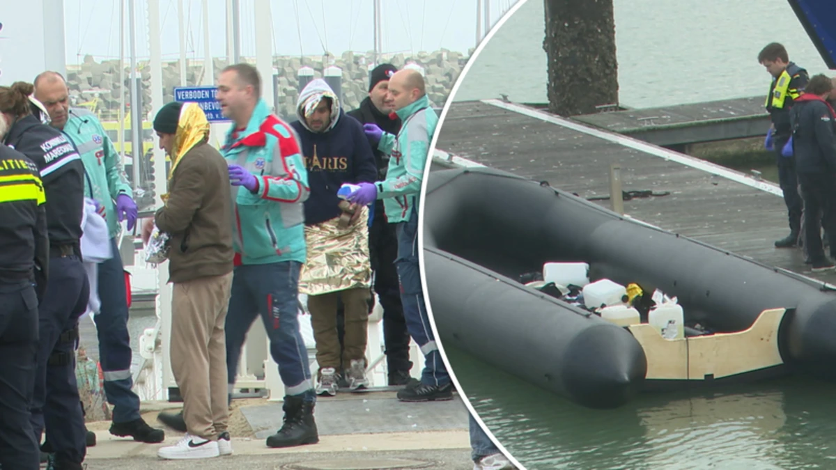 Bootje met tientallen vluchtelingen voor Nederlandse kust, twee mensen aangehouden